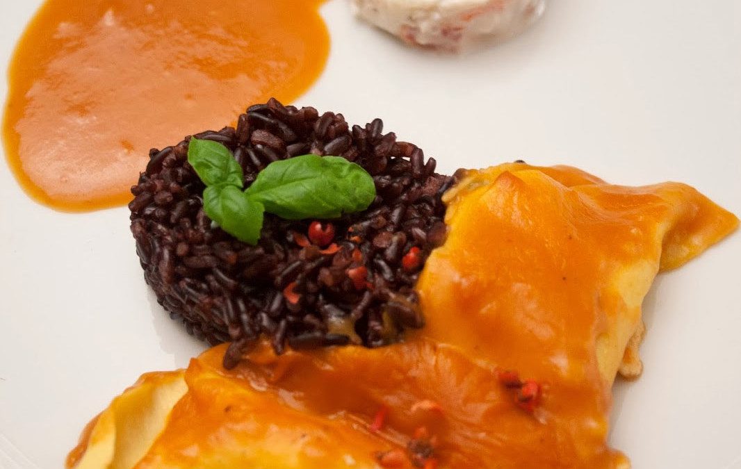 Ravioli van langoustine met zwarte rijst