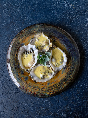 Lauwe oesters met kerrie en komijn
